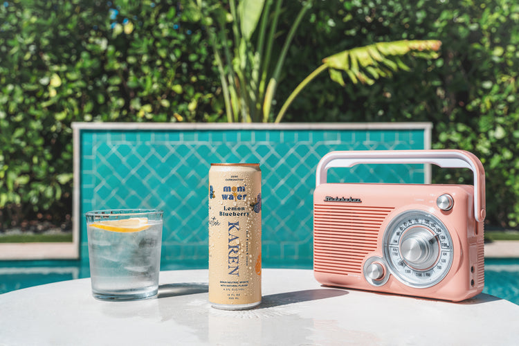 Image of the Karen can near a pool with a radio