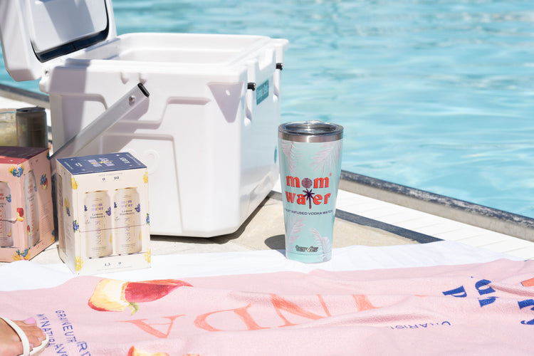 Picture of Mom Water cans, a cooler, and tumbler bottle with the mom water logo